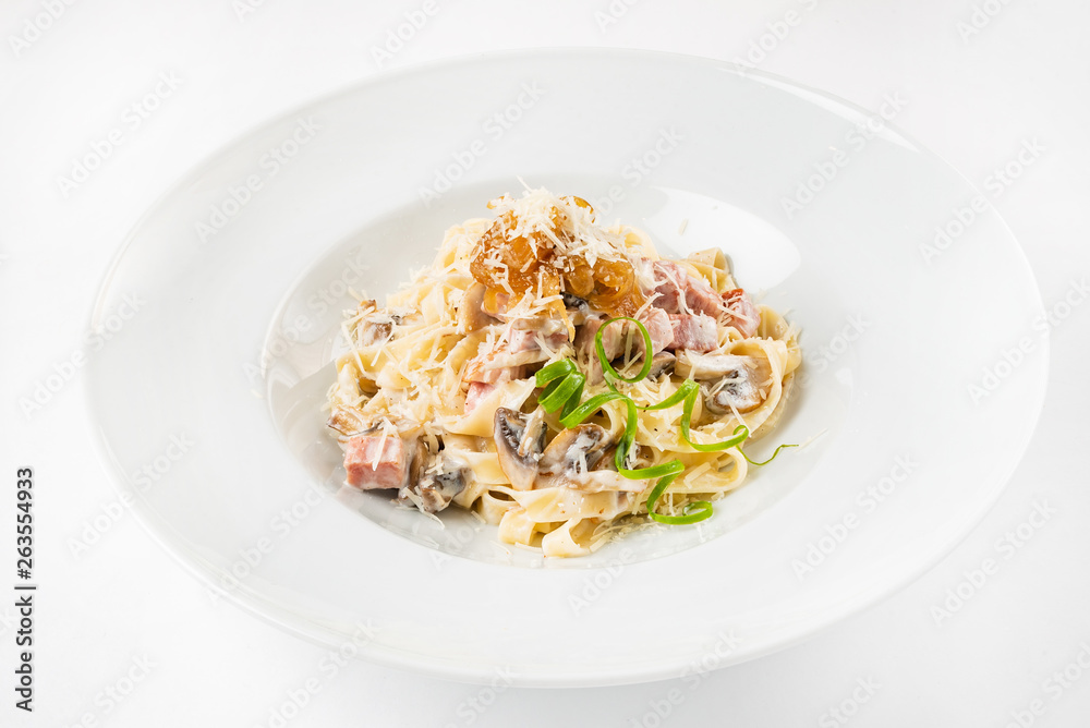 Carbonara pasta, spaghetti with pancetta, egg, hard parmesan cheese and cream sauce. Carbonara pasta, spaghetti with pancetta, egg, hard parmesan cheese and cream sauce.