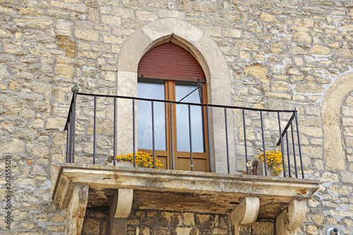 Balcony with flowers on a stone house  San Marino. UNESCO