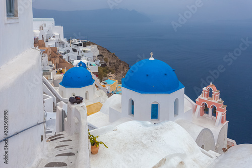 Blue dome in the village of Oia on a rare rainy day