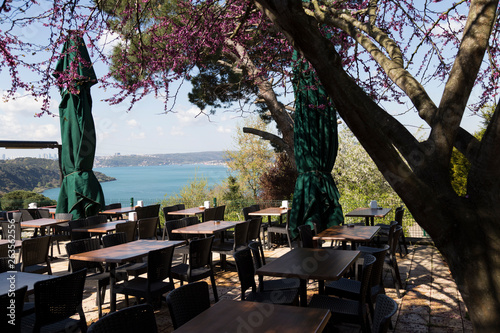 The people have a breakfast in the restaurant near the sea.the weather is beautiful in Beykoz.