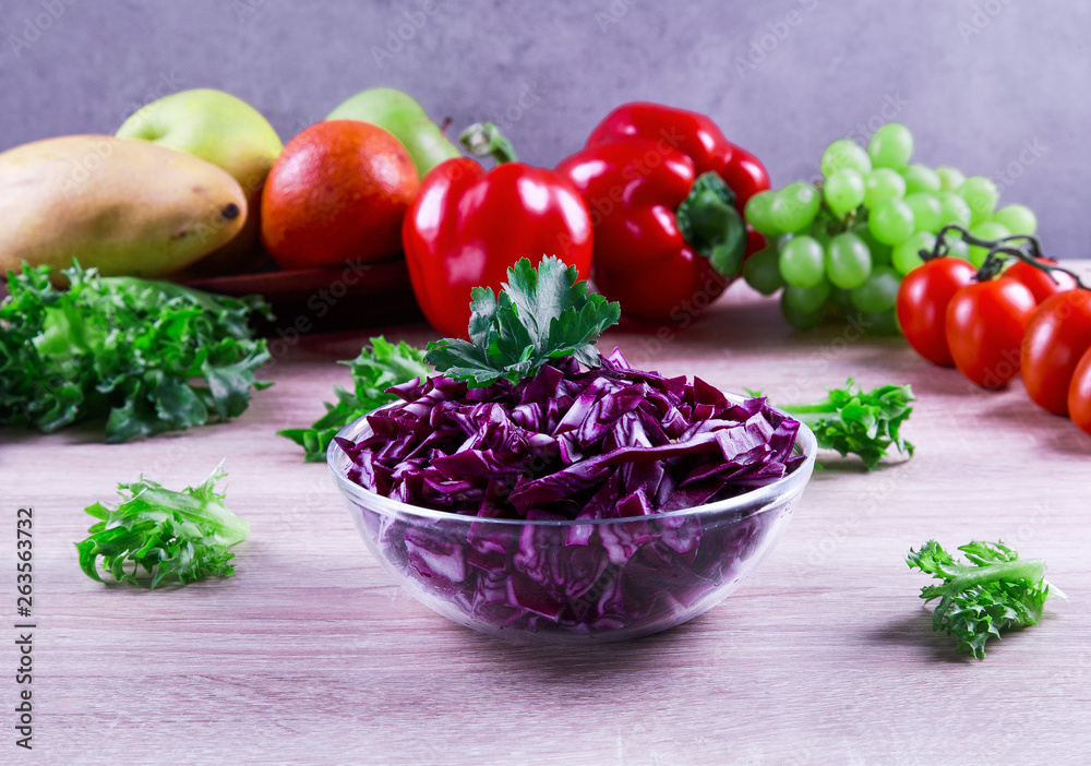 fresh red cabbage salad with vegetables in the background fresh red cabbage salad with vegetables in the background