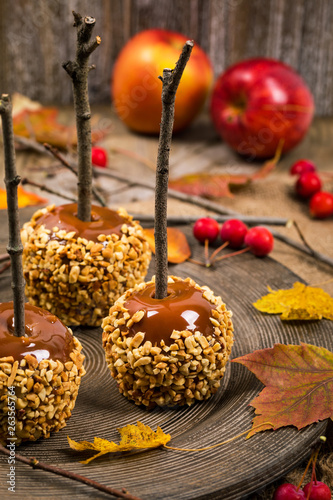 Caramel Apples on Wooden Background. Selective focus.