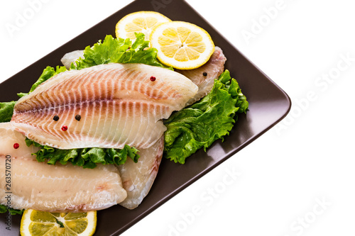Whitefish Tilapia Fish Raw Fillet Isolated on White. Selective focus.