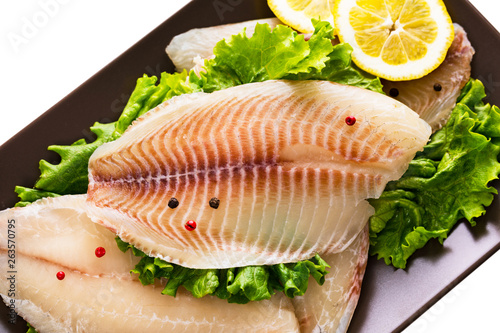 Whitefish Tilapia Fish Raw Fillet Isolated on White. Selective focus.