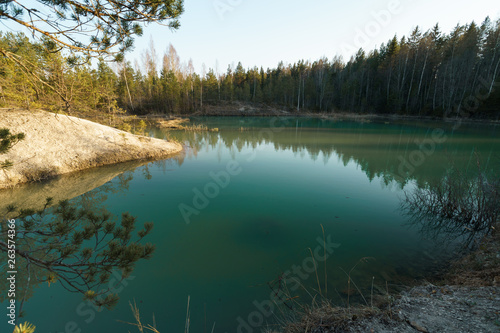 Fototapeta Naklejka Na Ścianę i Meble -  Beautiful turquoise lake in Latvia - Meditirenian style colors in Baltic states - Lackroga ezers