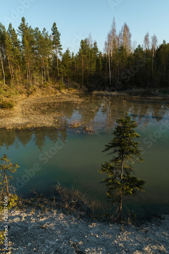 Beautiful turquoise lake in Latvia - Meditirenian style colors in Baltic states - Lackroga ezers photo