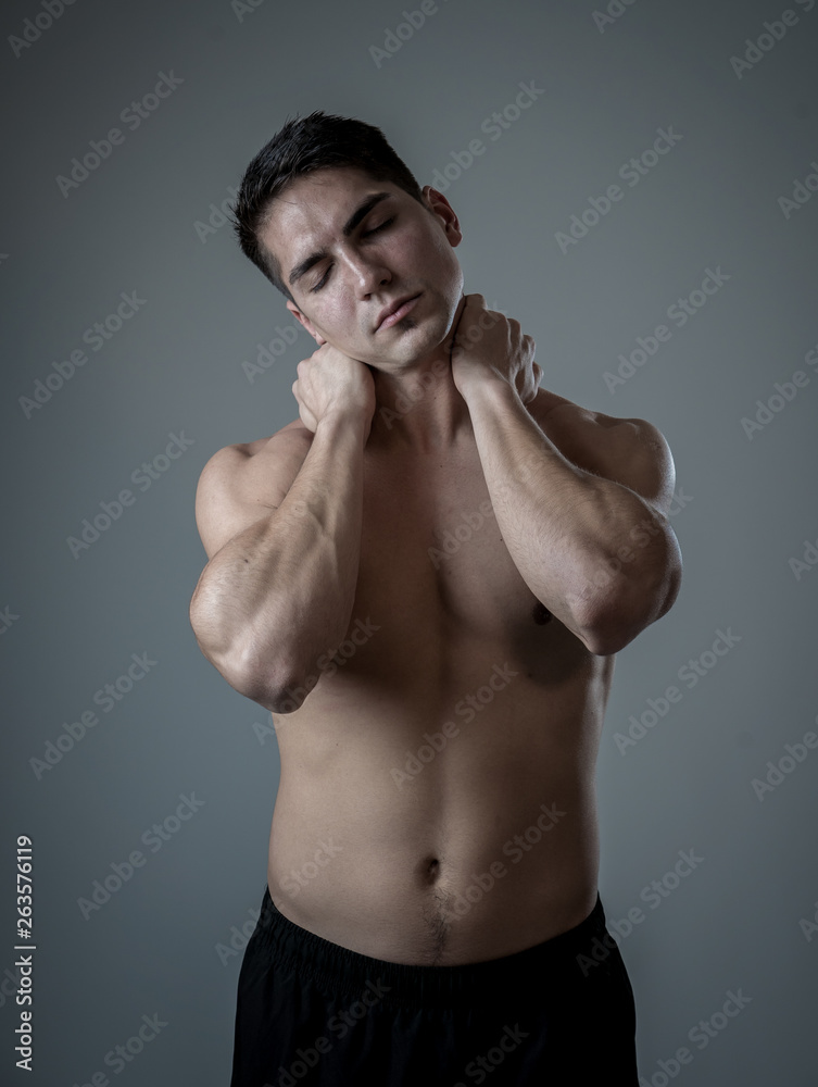Fototapeta premium Strong young man suffering neck and cervical pain