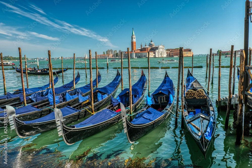 Gondola boats in Venice near Piazza San Marco, St Mark's Square with Gondola boats in Venice near Piazza San Marco, St Mark's Square with