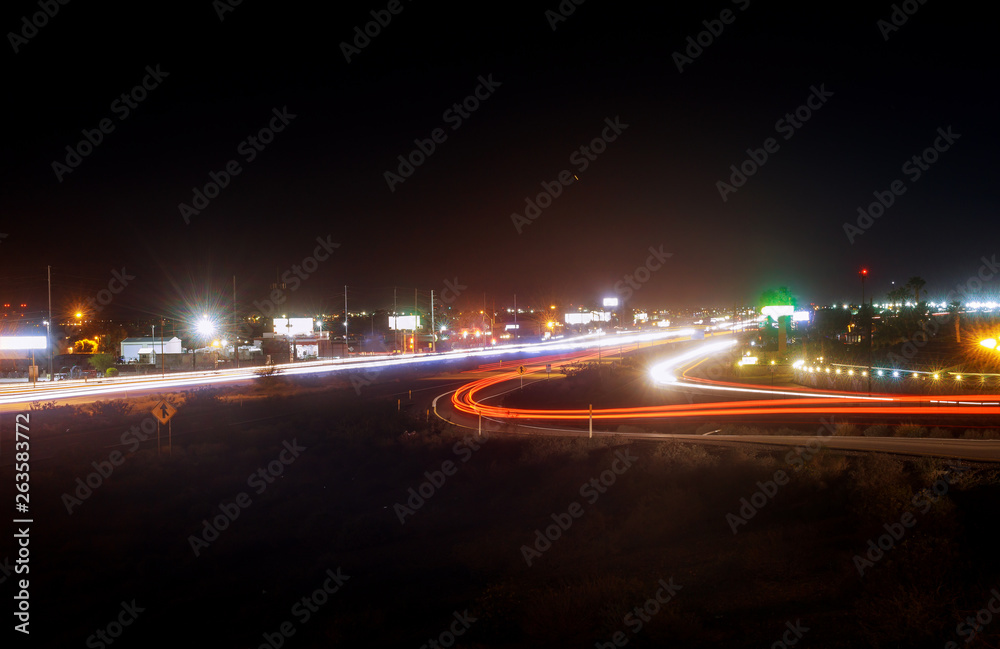 Speed traffic light highway at night, long exposure abstract urban background Speed traffic light highway at night, long exposure abstract urban background