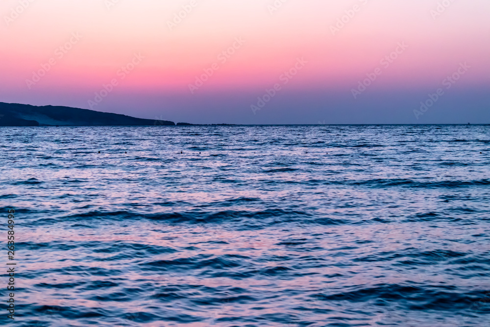 Fototapeta premium a wide landscape shoot of sea at sunset with awesome colors