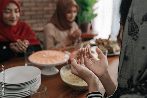 gesture of hand muslim praying in dining room before eating or break fasting