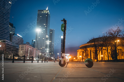 Rental electrical scooter on Warsaw night street