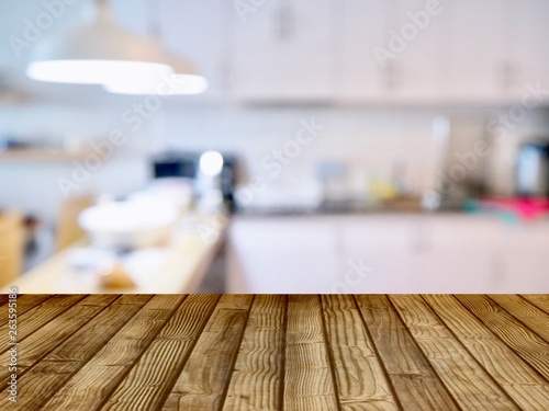 Products shelves and advertisements are wooden floors. The background is the kitchen for cooking  blurred images .