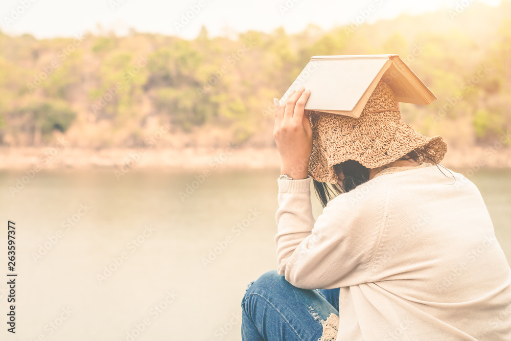 Women tourists read book in the holiday in quiet nature, Concept reading a book.