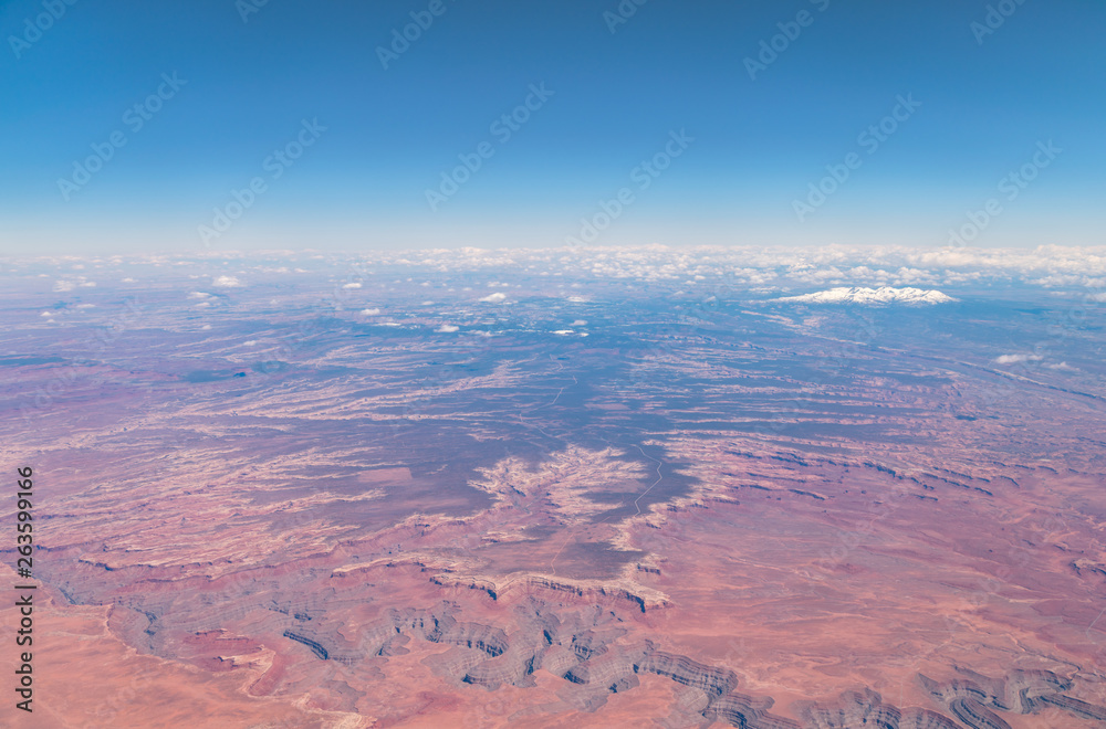 Aerial View of Large Canyons with Snowed PEak Mountain in the background