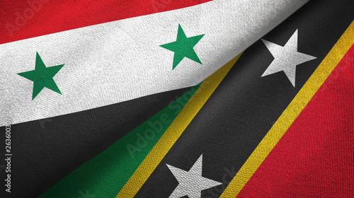 Syria and Saint Kitts and Nevis two flags textile cloth, fabric texture