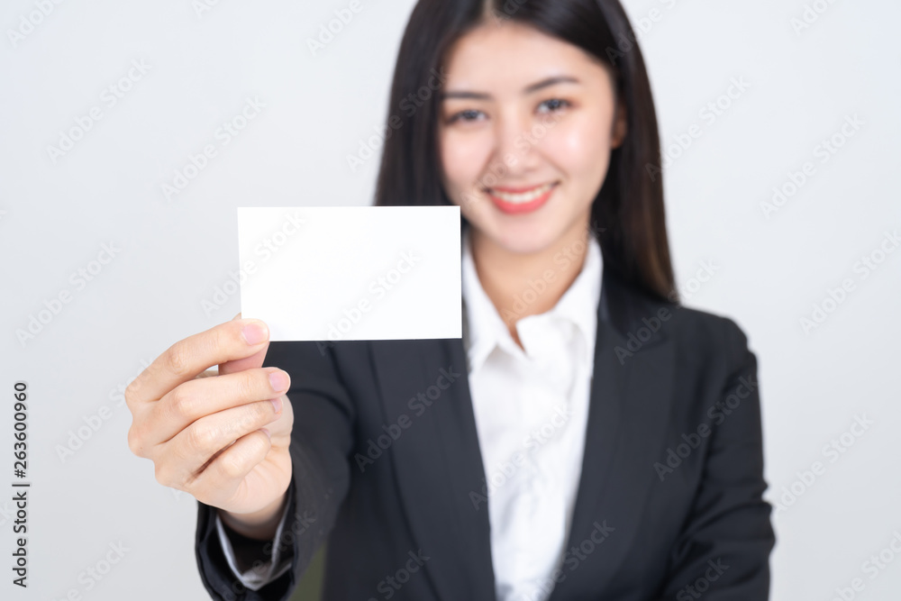 business woman holding and showing empty business card or name card - business concept business woman holding and showing empty business card or name card - business concept