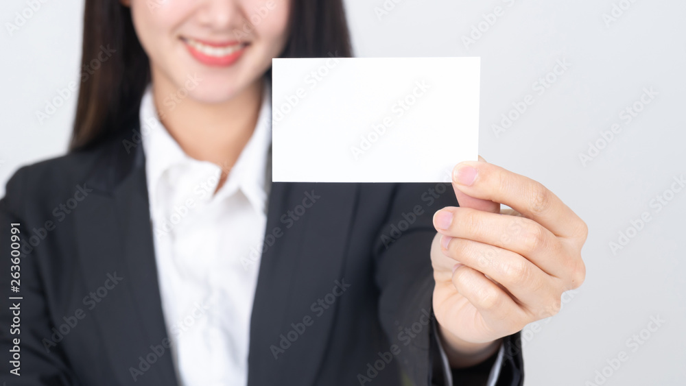 business woman holding and showing empty business card or name card - business concept business woman holding and showing empty business card or name card - business concept