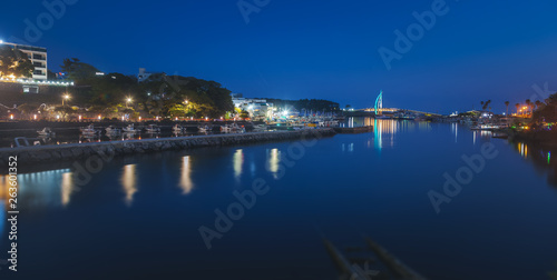 Bright night landscape, bridge in Seogwipo-si  Jeju Island, South Korea. Night illumination, long exposure © olezzo