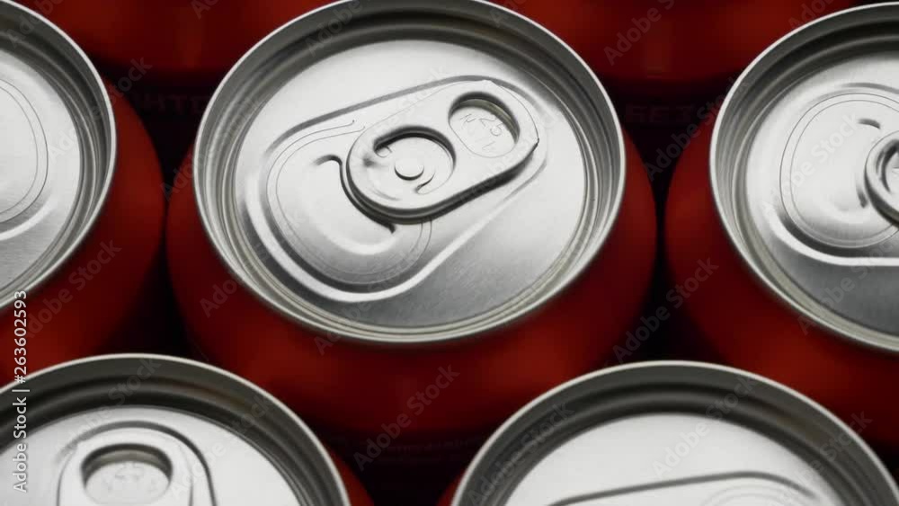 top view on red can of soda or beer rotate background. Slow motion video dolly crane shot medium extreme close up panorama high angle telephoto lens top view on red can of soda or beer rotate background. Slow motion video dolly crane shot medium extreme close up panorama high angle telephoto lens
