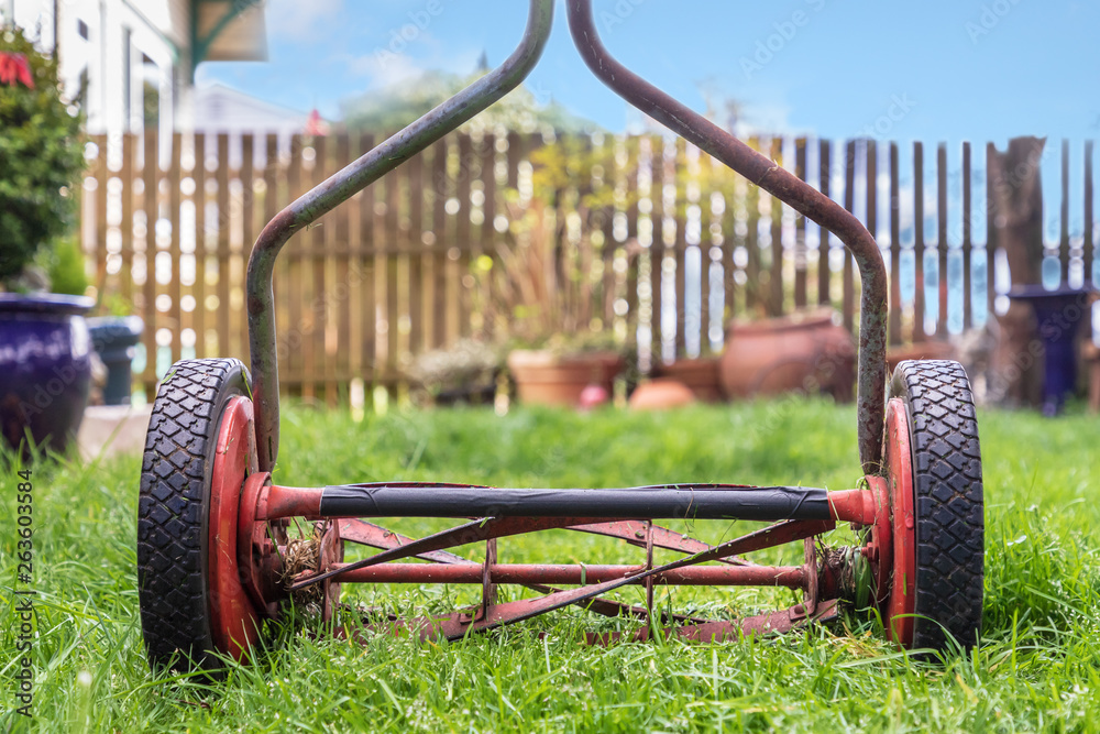 Close Up of Old Worn Rusted Hand Powered Lawn Mower Close Up of Old Worn Rusted Hand Powered Lawn Mower