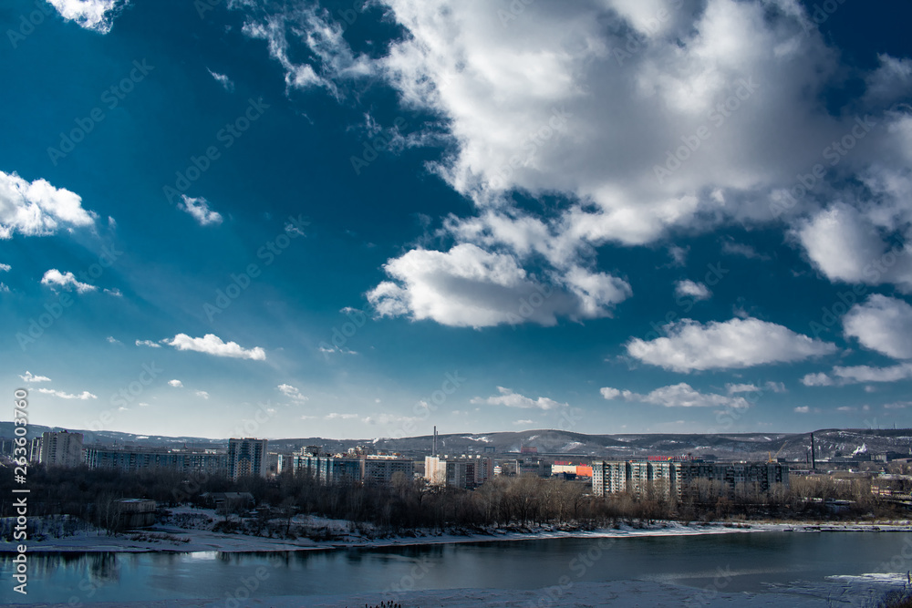 clouds over the river and the city of Novokuznetsk