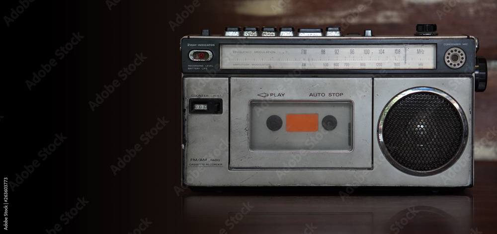 Fototapeta premium front view antique black and silver radio on wooden background,copy space
