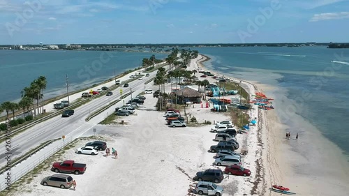 Island fun. This is part of a 21 clip collection of boats, island fly overs, wave runners, paddle boarders, canoes and more. Smooth buttery shots of sun island adventures in Tampa Florida. photo