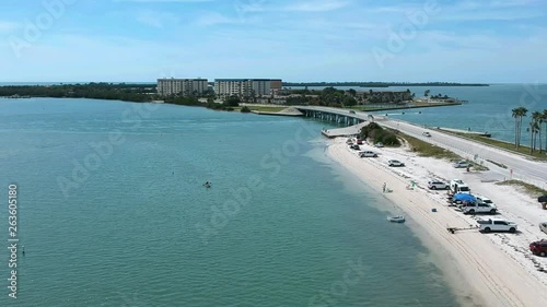 Island fun. This is part of a 21 clip collection of boats, island fly overs, wave runners, paddle boarders, canoes and more. Smooth buttery shots of sun island adventures in Tampa Florida.