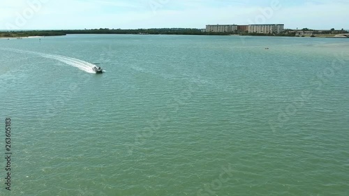 Island fun. This is part of a 21 clip collection of boats, island fly overs, wave runners, paddle boarders, canoes and more. Smooth buttery shots of sun island adventures in Tampa Florida.