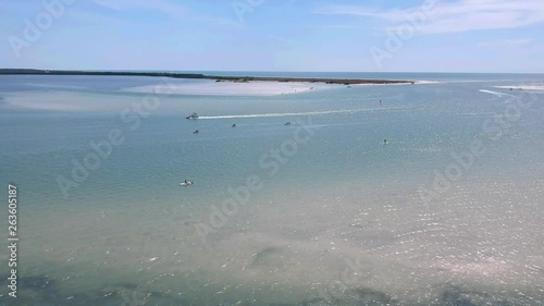 Island fun. This is part of a 21 clip collection of boats, island fly overs, wave runners, paddle boarders, canoes and more. Smooth buttery shots of sun island adventures in Tampa Florida.