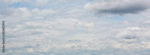 panorama image, dramatic cloud moving above blue sky, cloudy day weather background © sutichak