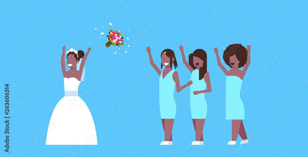 Fototapeta premium Bride in white dress throwing bouquet