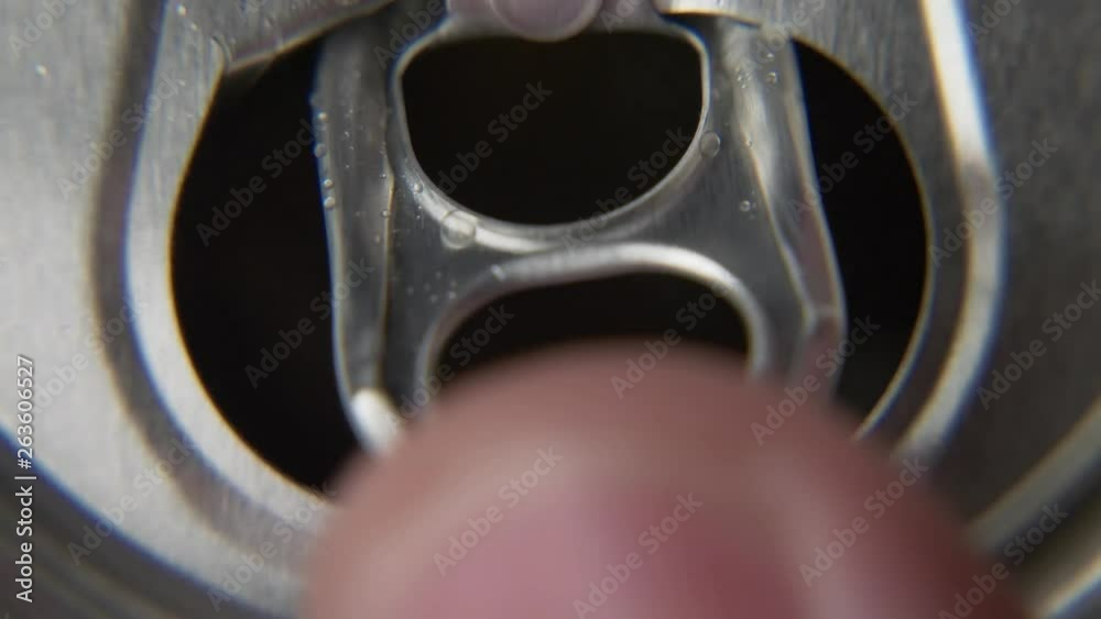 top view of white man open red can of soda or beer. unhealthy eating. hand opening. Slow motion video medium extreme close up high angle telephoto lens audio sound of the opening drink top view of white man open red can of soda or beer. unhealthy eating. hand opening. Slow motion video medium extreme close up high angle telephoto lens audio sound of the opening drink