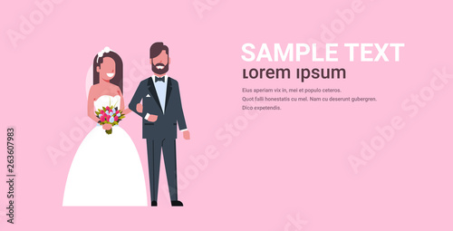 newlyweds just married man woman standing together romantic couple bride and groom in love wedding day concept pink background copy space full length horizontal flat
