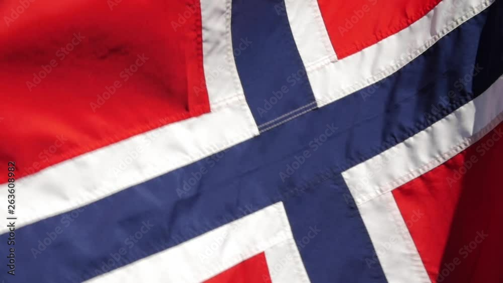 A Norwegian flag waving in the wind.
