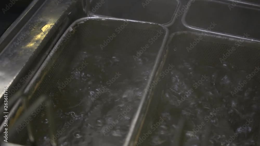 Bubbles from boiling oil water in the kitchen of a fast food restaurant hd stock footage Bubbles from boiling oil water in the kitchen of a fast food restaurant hd stock footage