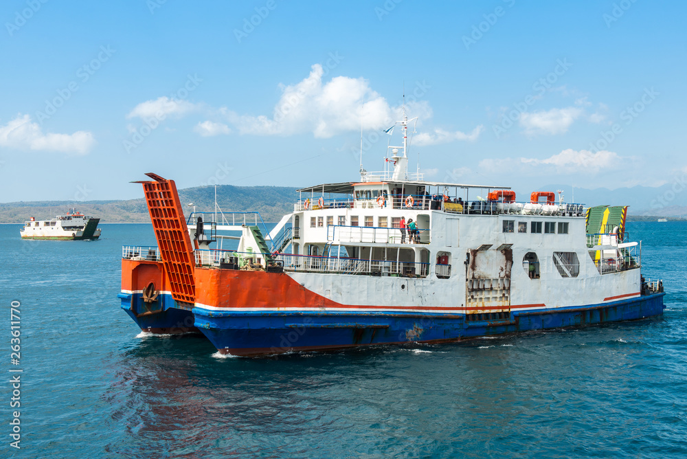 Bali public ferry ship carrying passengers from Gilimanuk harbour ferry  port in Bali Island to Ketapang harbour East Java, Indonesia. Stock Photo |  Adobe Stock