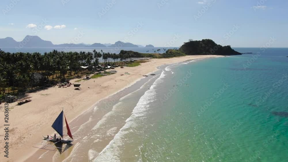 Beautiful beach with people and a sailing ship. Beautiful beach with people and a sailing ship.