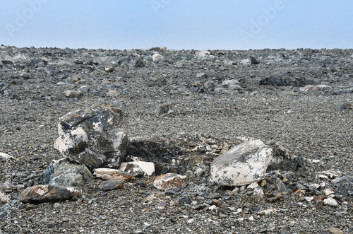 Head-shaped stone on the shore of the sacred lake Rakshas Tal (Langa-TSO) photo