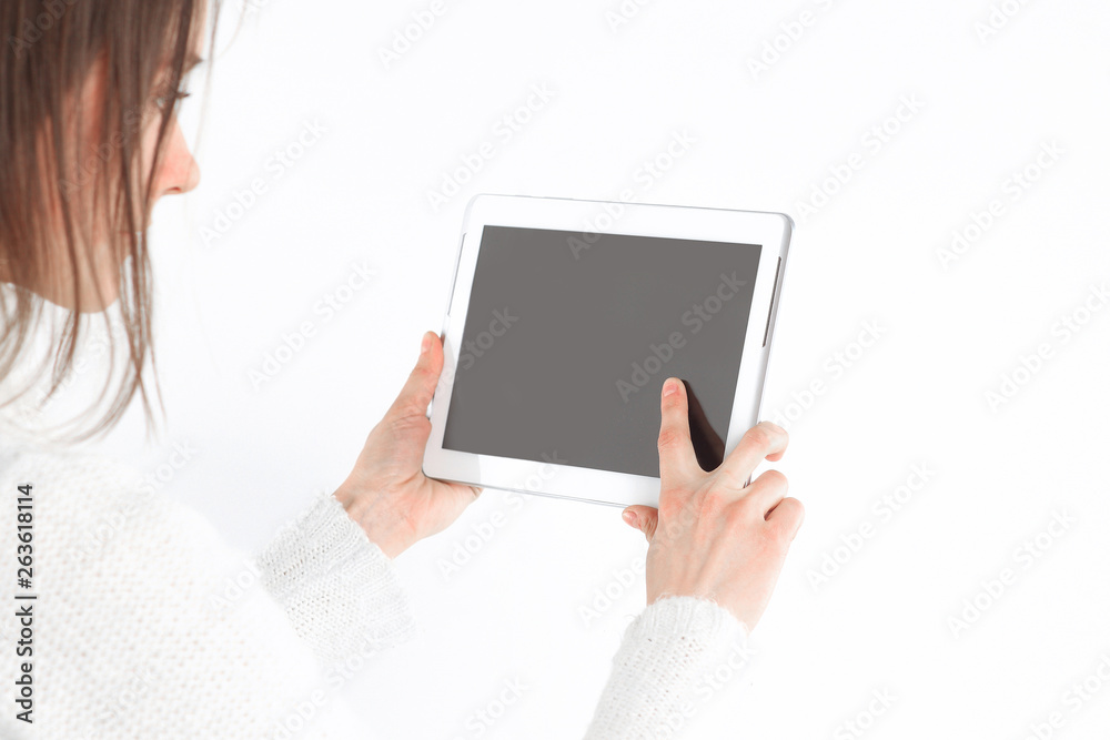 close up. young woman tapping the screen of digital tablet.photo with copy space