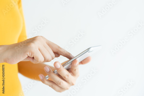 close up the hands of women using smartphone on white background