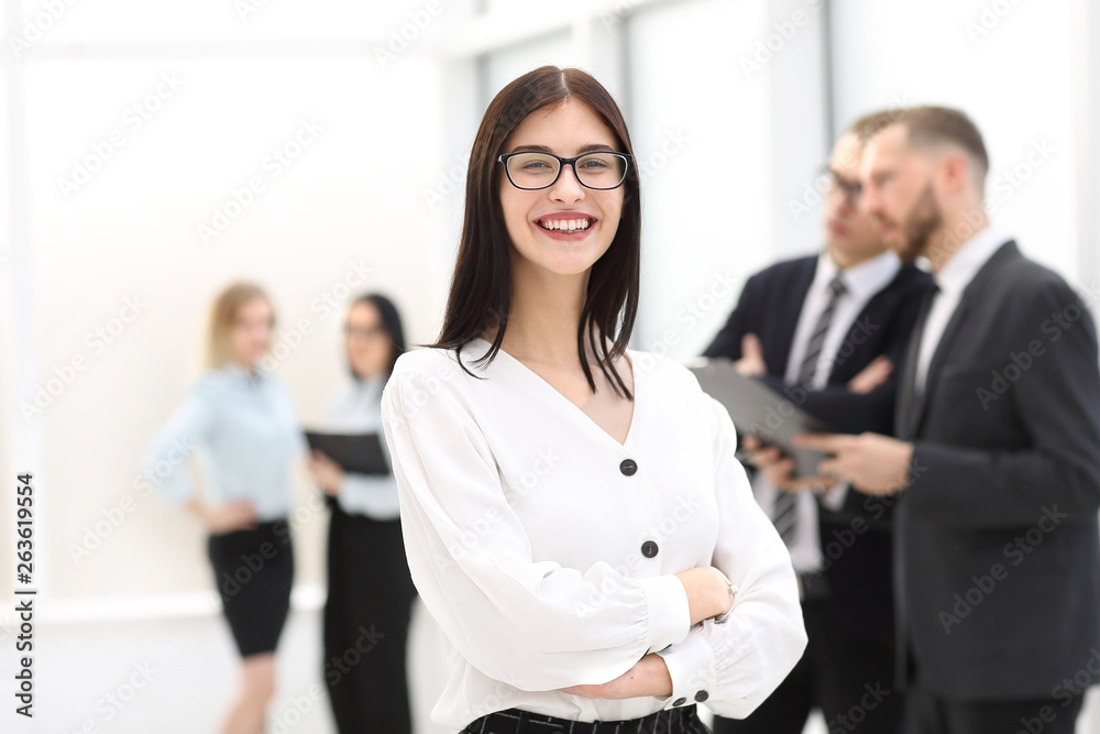portrait of a happy businesswoman standing in the lobby office. portrait of a happy businesswoman standing in the lobby office.