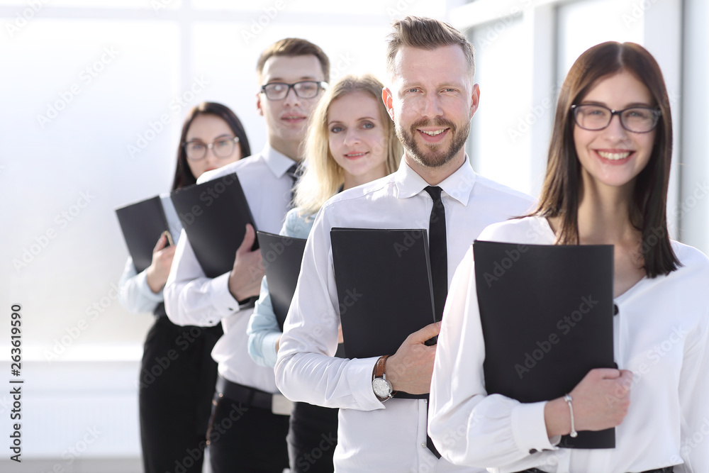 close up. employees with file folders standing in line. close up. employees with file folders standing in line.