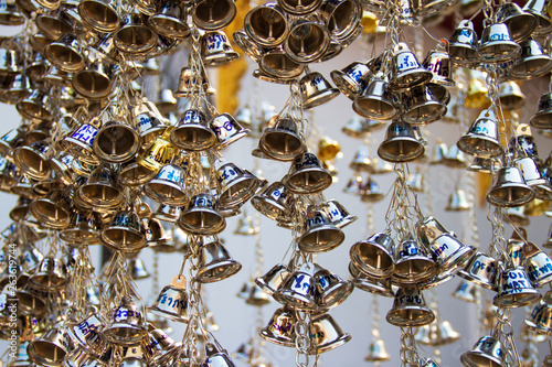 Muang, Phrae, Thailand - February 9, 2019: Many silver small bells hanging in the temple to pray for famous reputation like the sound of the bell.