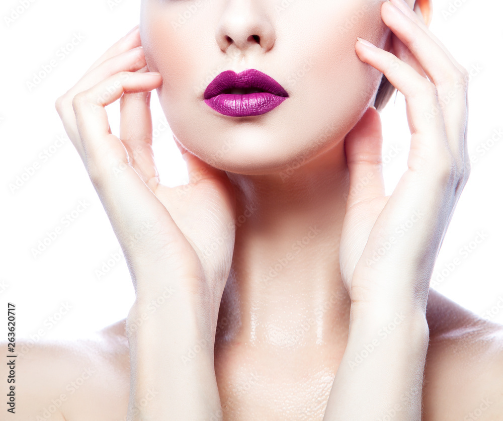 Fototapeta premium Woman beauty part of face, hands and body. Purple lips bright make-up, clean skin. Isolated. White background