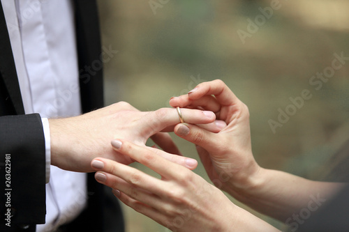 close up. the couple exchanging wedding rings