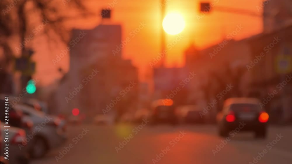 Cars are driving along in the evening. Evening. The setting sun. No focus. Defocus. Evening road. Blur effect. Road traffic. Cars are driving along in the evening. Evening. The setting sun. No focus. Defocus. Evening road. Blur effect. Road traffic.