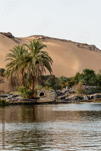 Sunset, Sand dunes on the Coastline of the Nile river part called First Cataract, Aswan Egypt photo