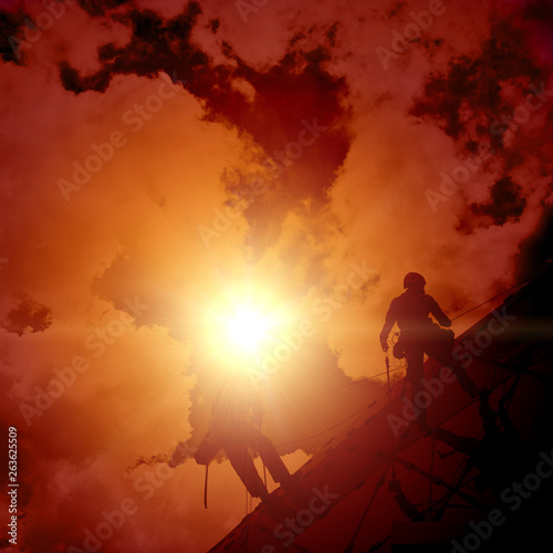 industrial climber on the ropes, silhouette.